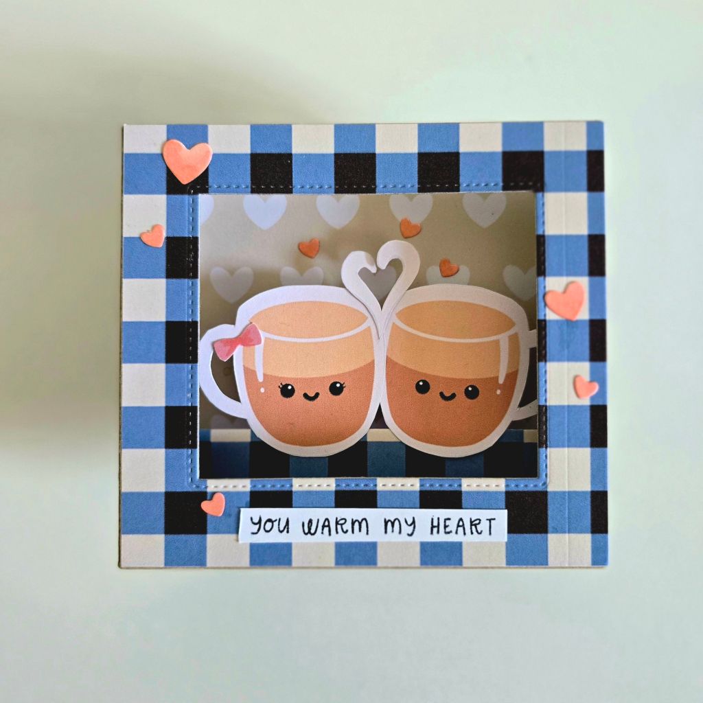Handmade coffee-themed shadow box card featuring Hugs in a Card digital papers in blue and brown, accented with a cute coffee cup couple and heart embellishments
